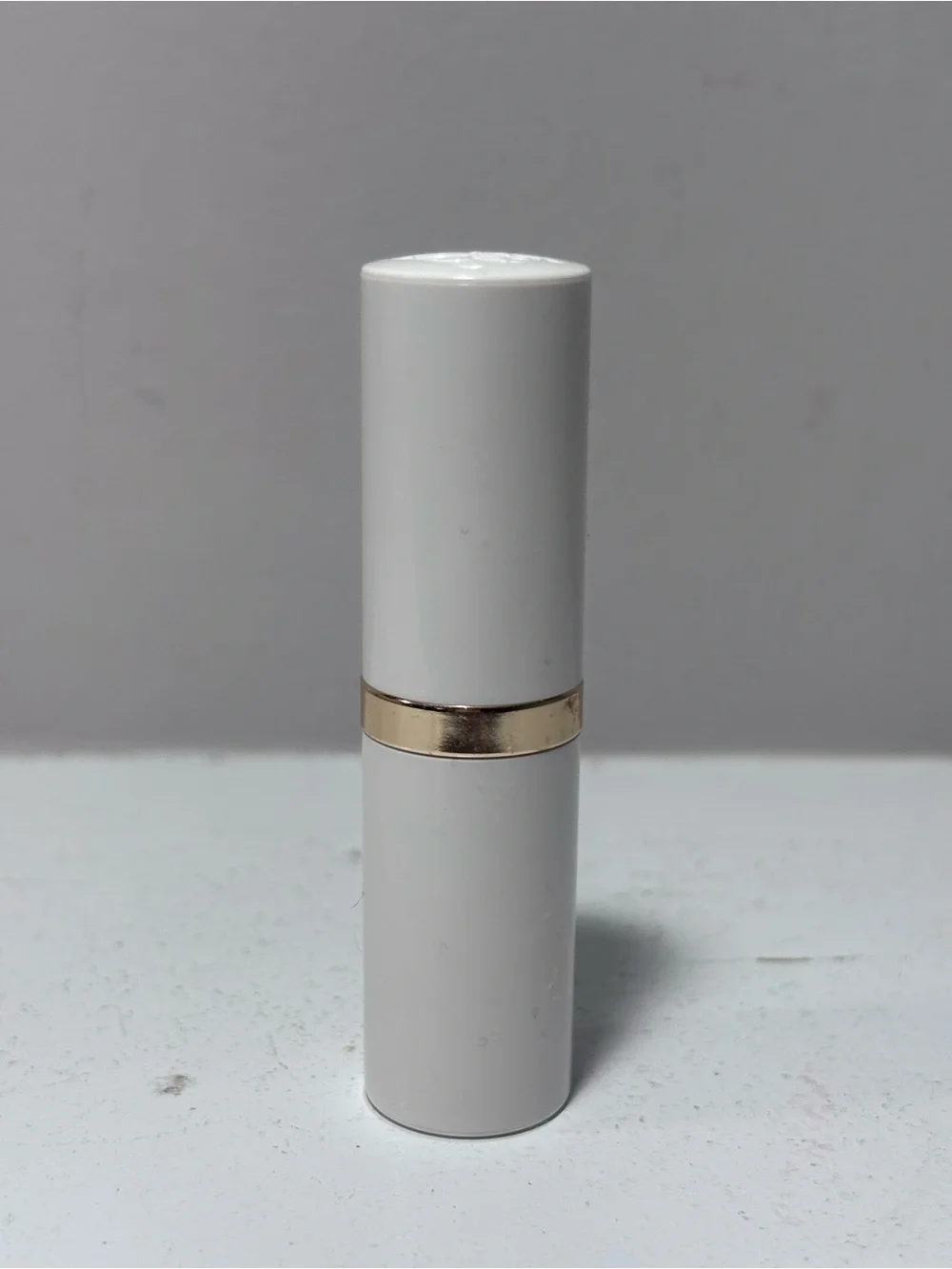 Estée Lauder Lip Conditioner Lipstick .13 Fl Oz - White Tube with Gold Accent